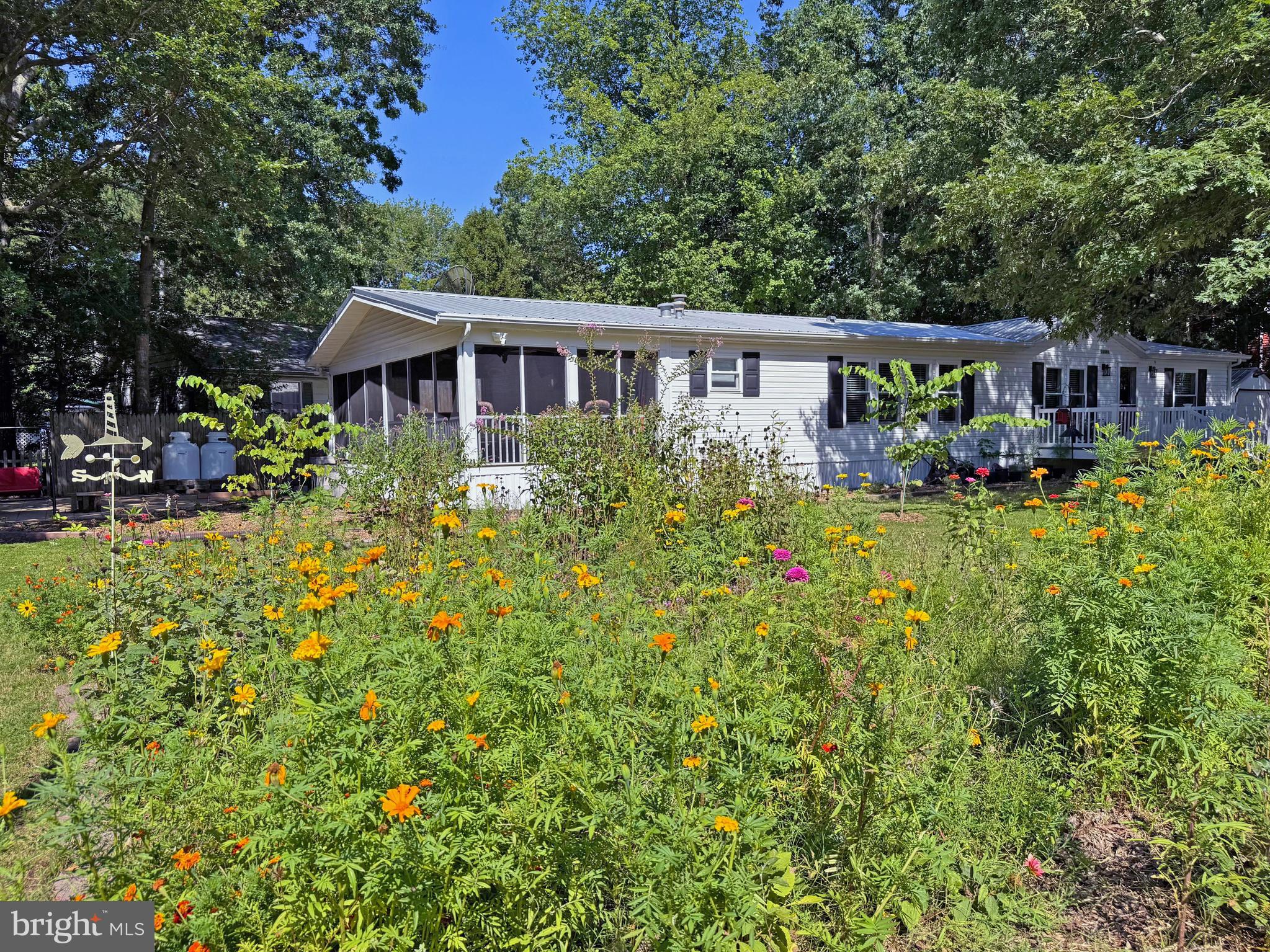 33280 Sassafras Court Ocean View, DE 19970 - Photo 39 of 45 a view of a house with a big yard and large trees