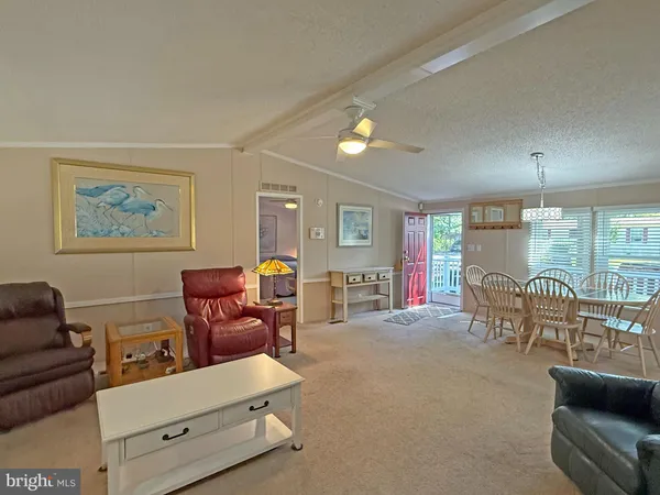 a living room with furniture and a lamp