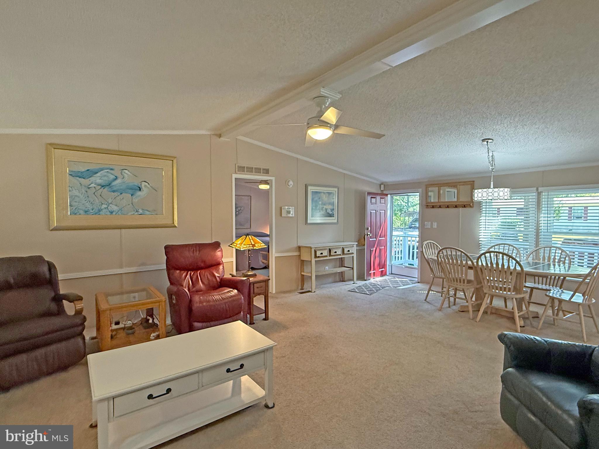 33280 Sassafras Court Ocean View, DE 19970 - Photo 4 of 45 a living room with furniture and a lamp