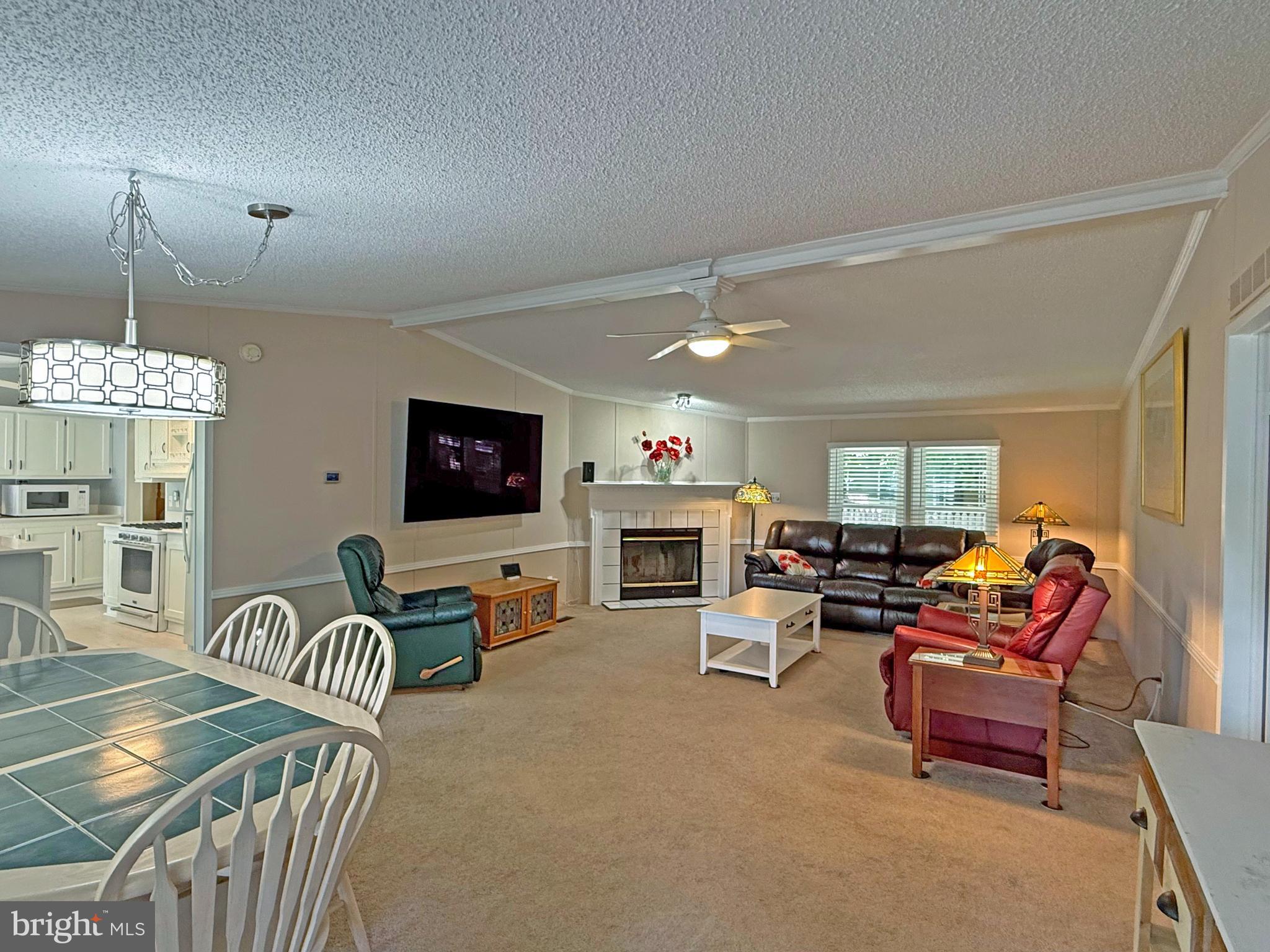 33280 Sassafras Court Ocean View, DE 19970 - Photo 7 of 45 a living room with furniture and a flat screen tv