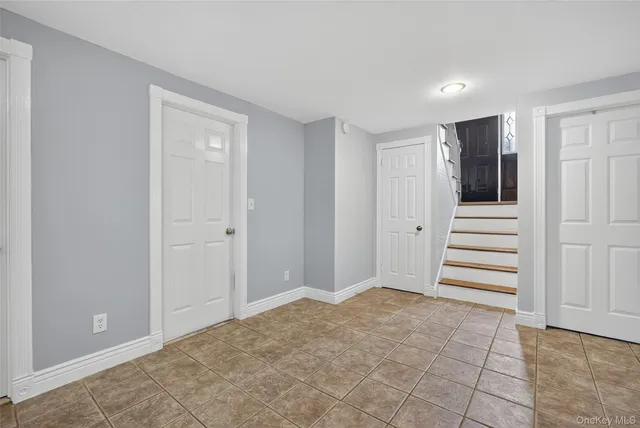 a house view with a sitting space and garden