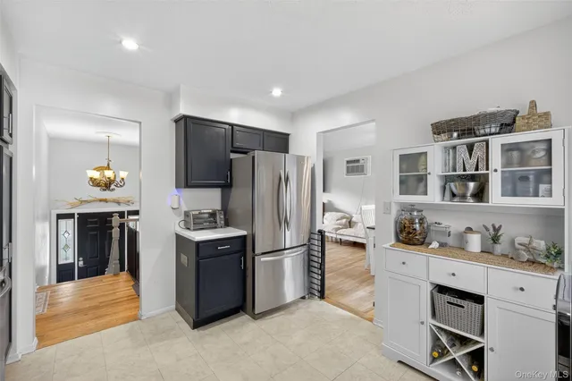 a kitchen with stainless steel appliances a stove sink and refrigerator