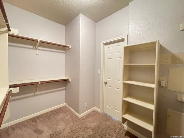 a view of an empty walk in closet
