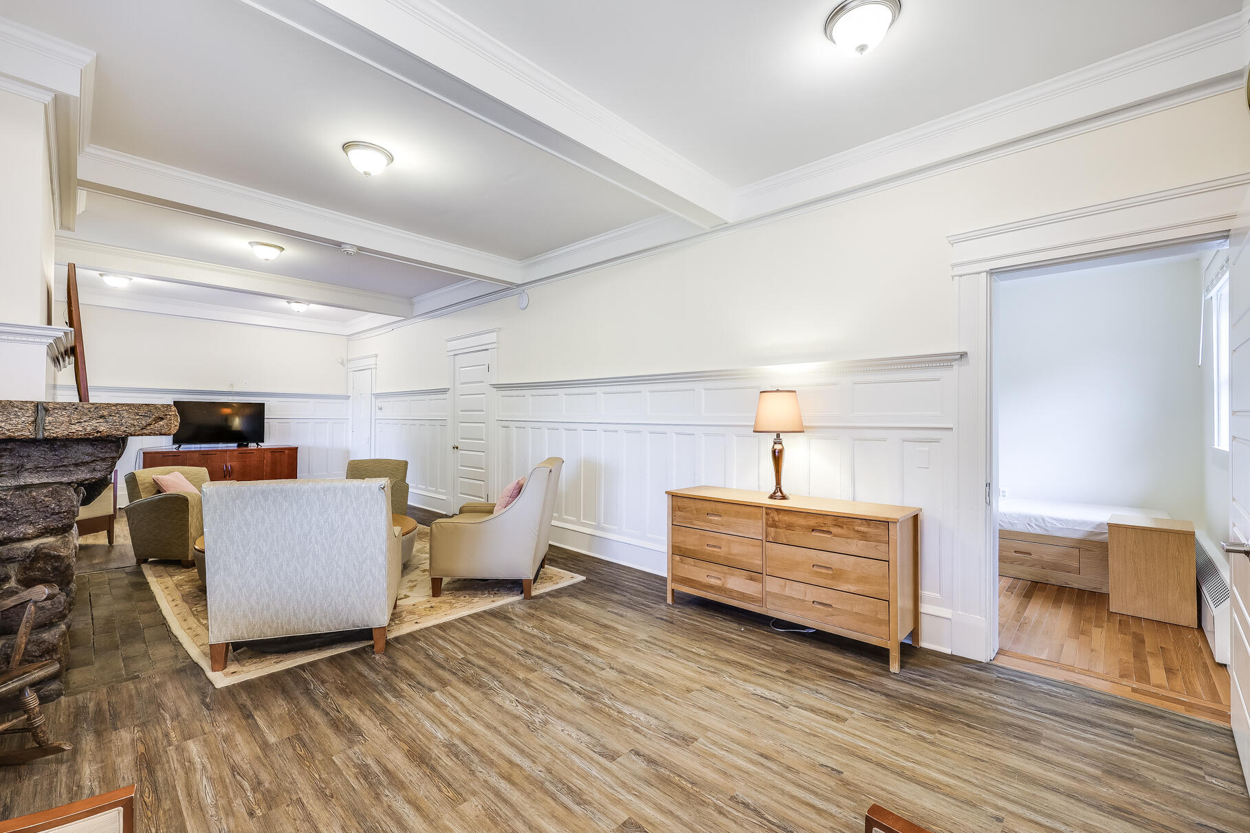 165 Woods Hole Road Falmouth, MA 02540 - Photo 15 of 35 a living room with furniture and a wooden floor