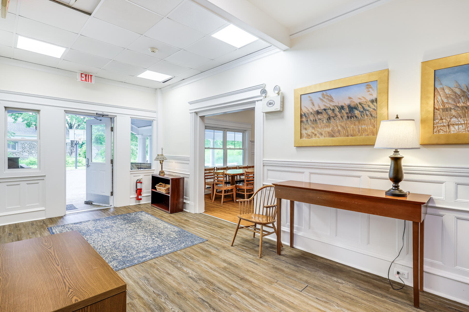 165 Woods Hole Road Falmouth, MA 02540 - Photo 17 of 35 a living room with furniture and a fireplace
