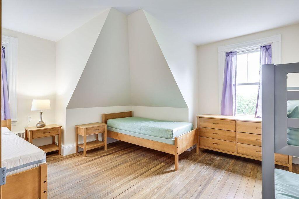 165 Woods Hole Road Falmouth, MA 02540 - Photo 19 of 35 a living room with furniture and a wooden floor