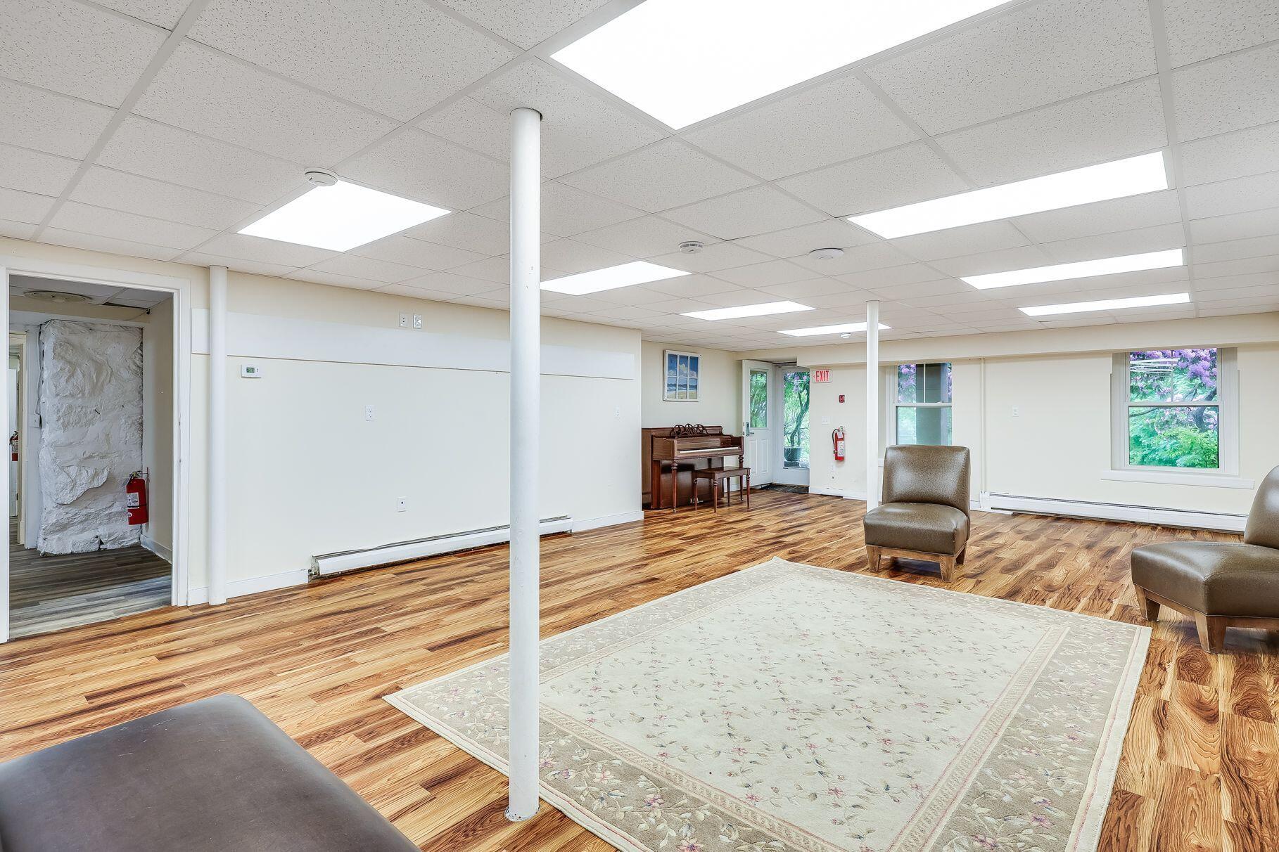 165 Woods Hole Road Falmouth, MA 02540 - Photo 21 of 35 a view of a livingroom with furniture and a rug