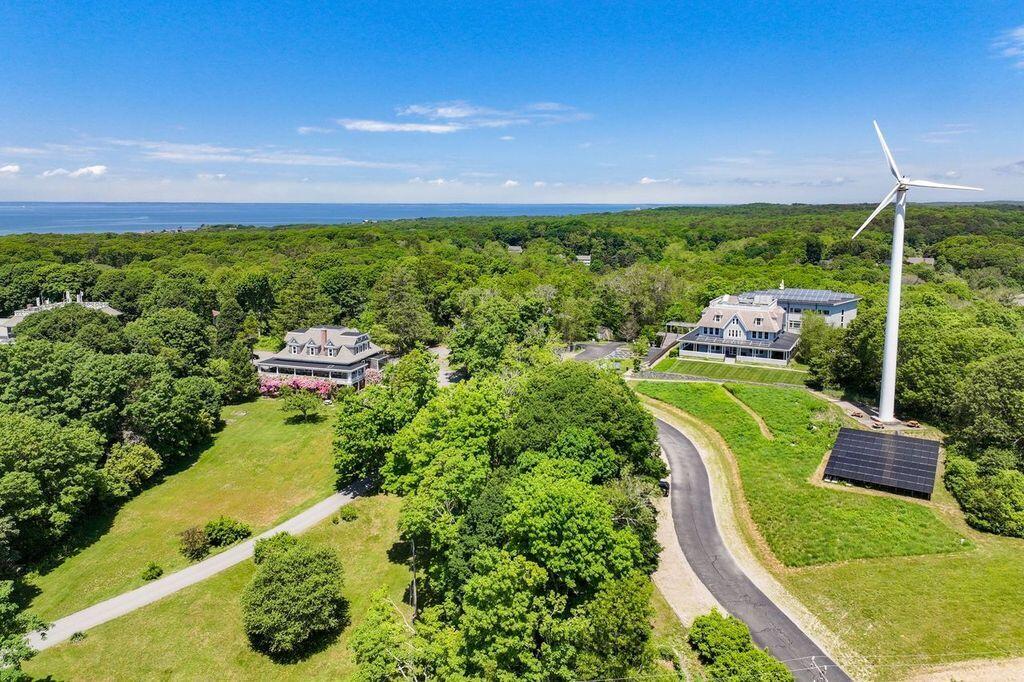 165 Woods Hole Road Falmouth, MA 02540 - Photo 22 of 35 a view of a golf course with chairs