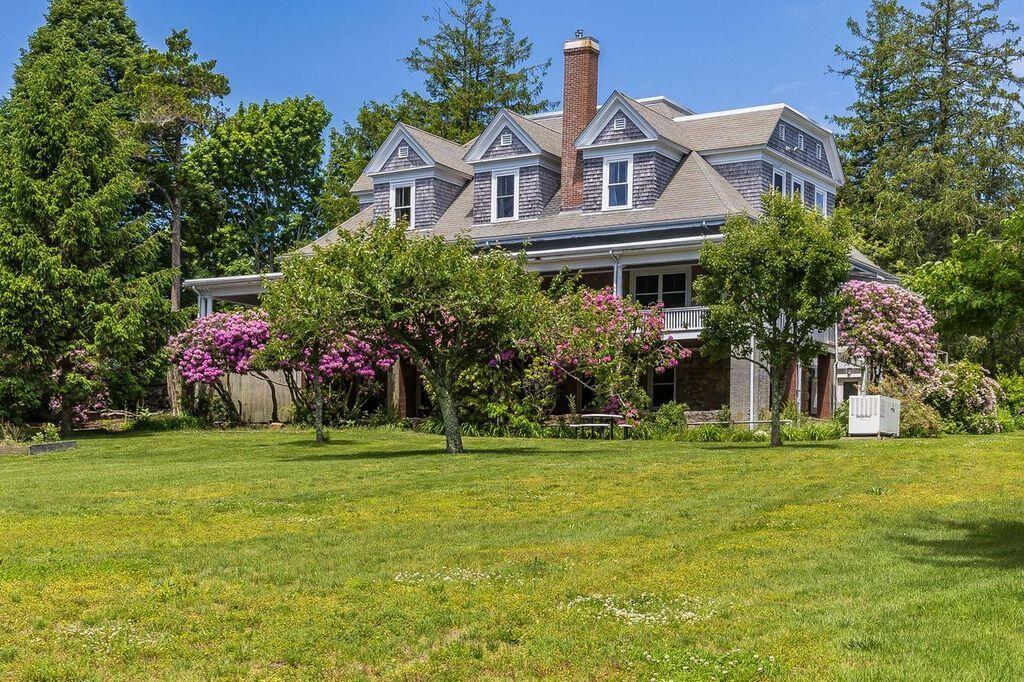 165 Woods Hole Road Falmouth, MA 02540 - Photo 25 of 35 a front view of a house with a garden