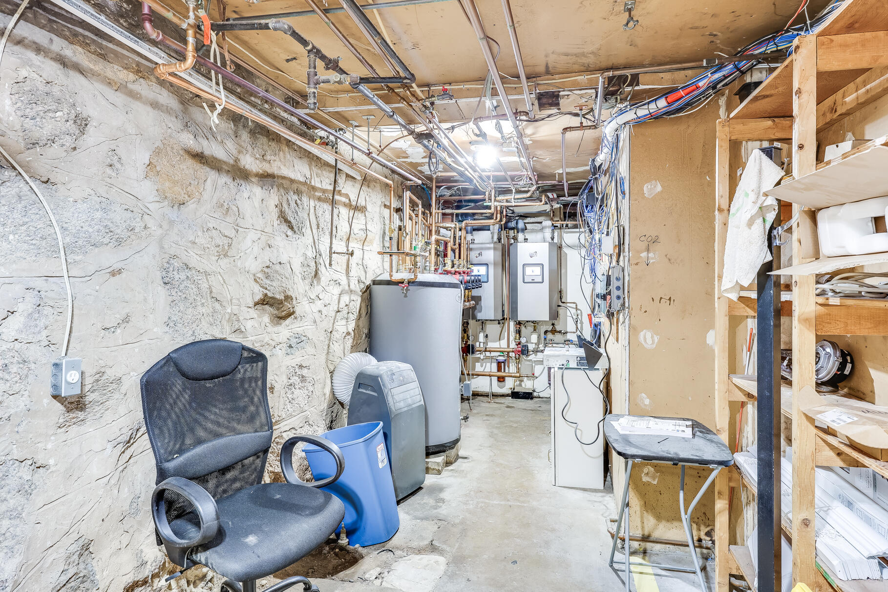 165 Woods Hole Road Falmouth, MA 02540 - Photo 30 of 35 a living room with furniture and a chandelier