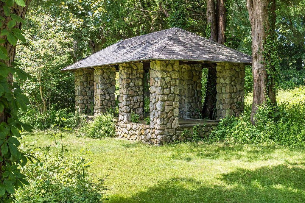 165 Woods Hole Road Falmouth, MA 02540 - Photo 5 of 35 a view of a backyard with plants