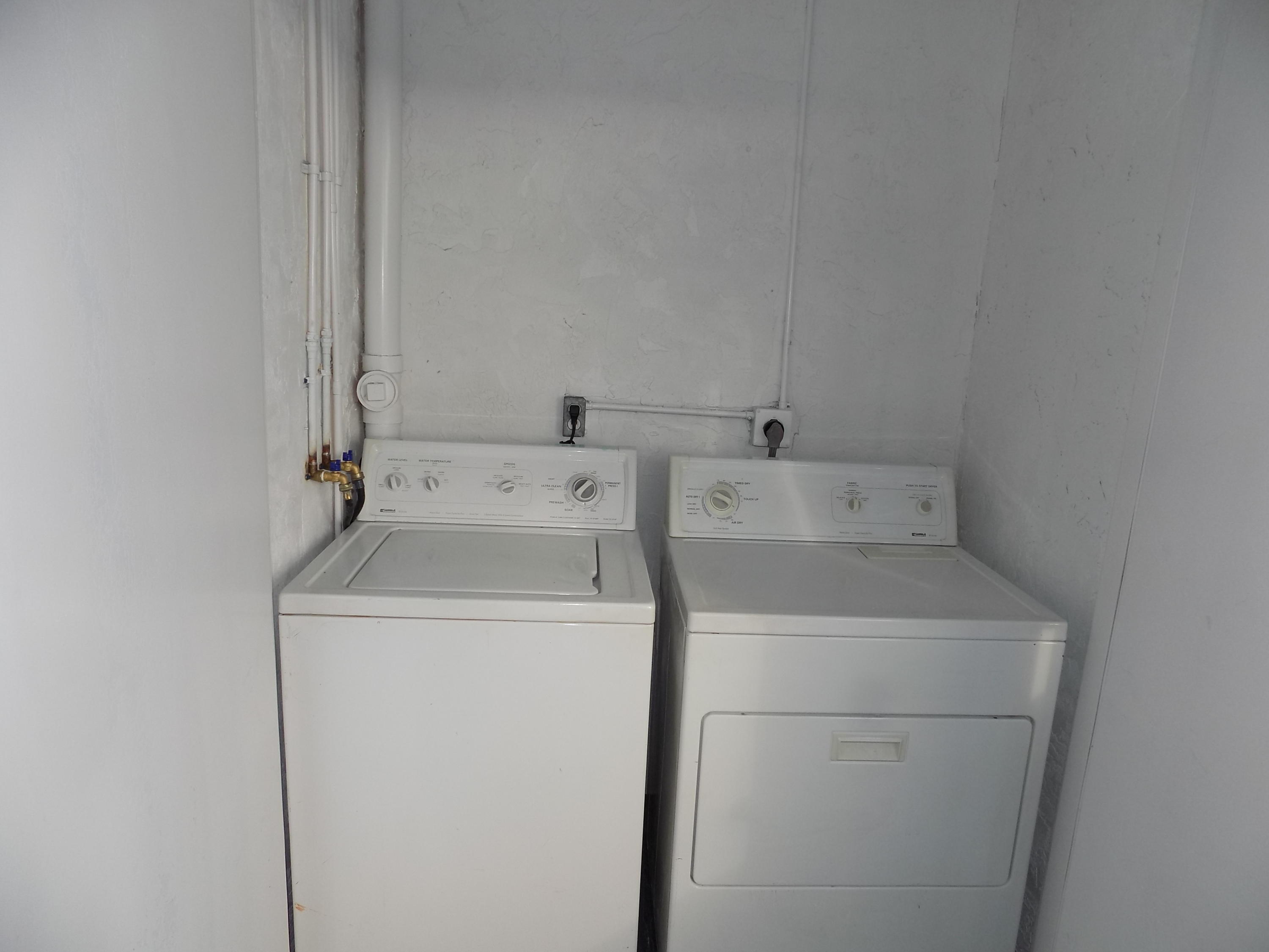 1798 Abbey Road, Unit C201 West Palm Beach, FL 33415 - Photo 21 of 26 Patio Washer/ Dryer Area