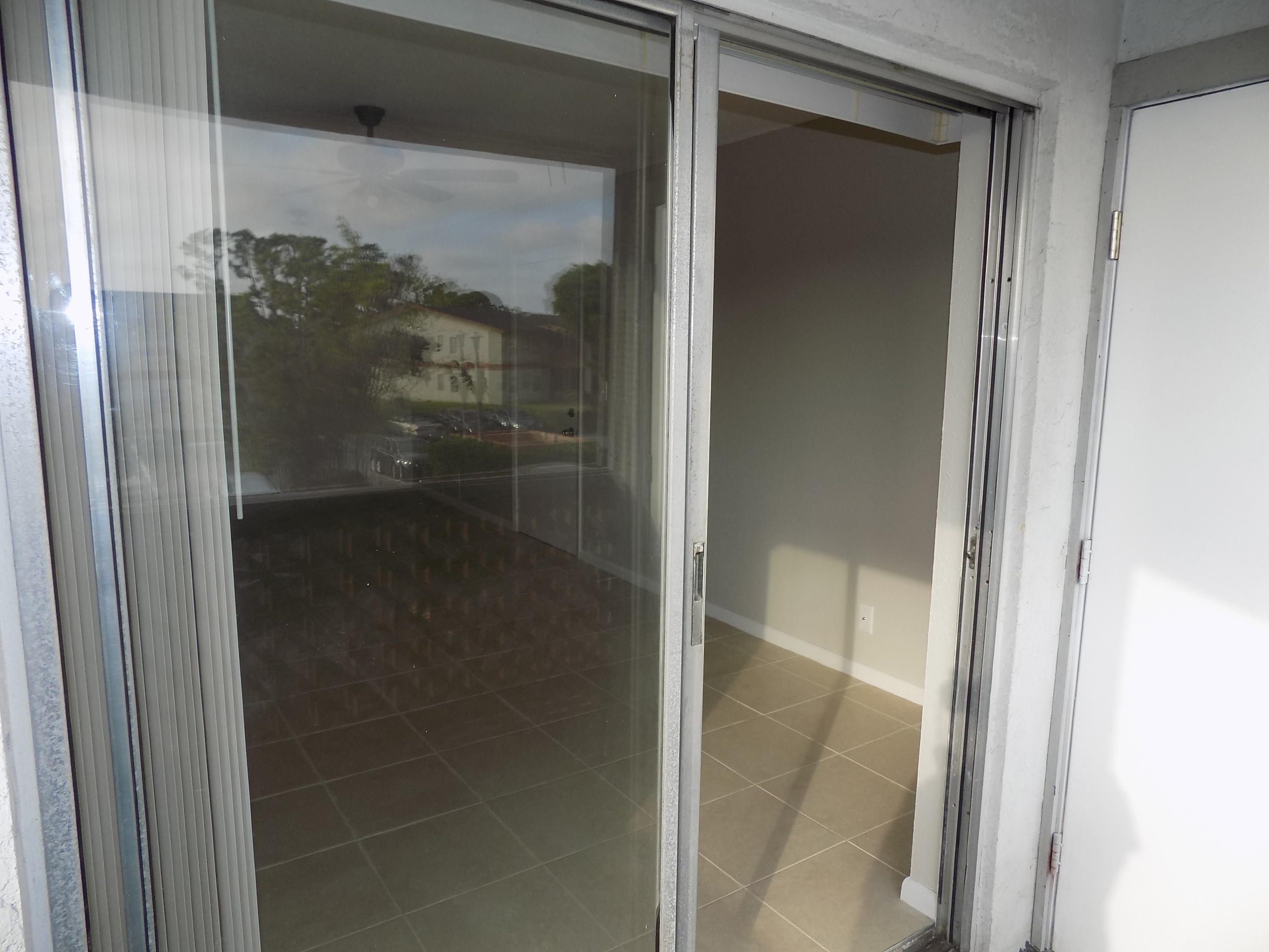 1798 Abbey Road, Unit C201 West Palm Beach, FL 33415 - Photo 22 of 26 Patio Area