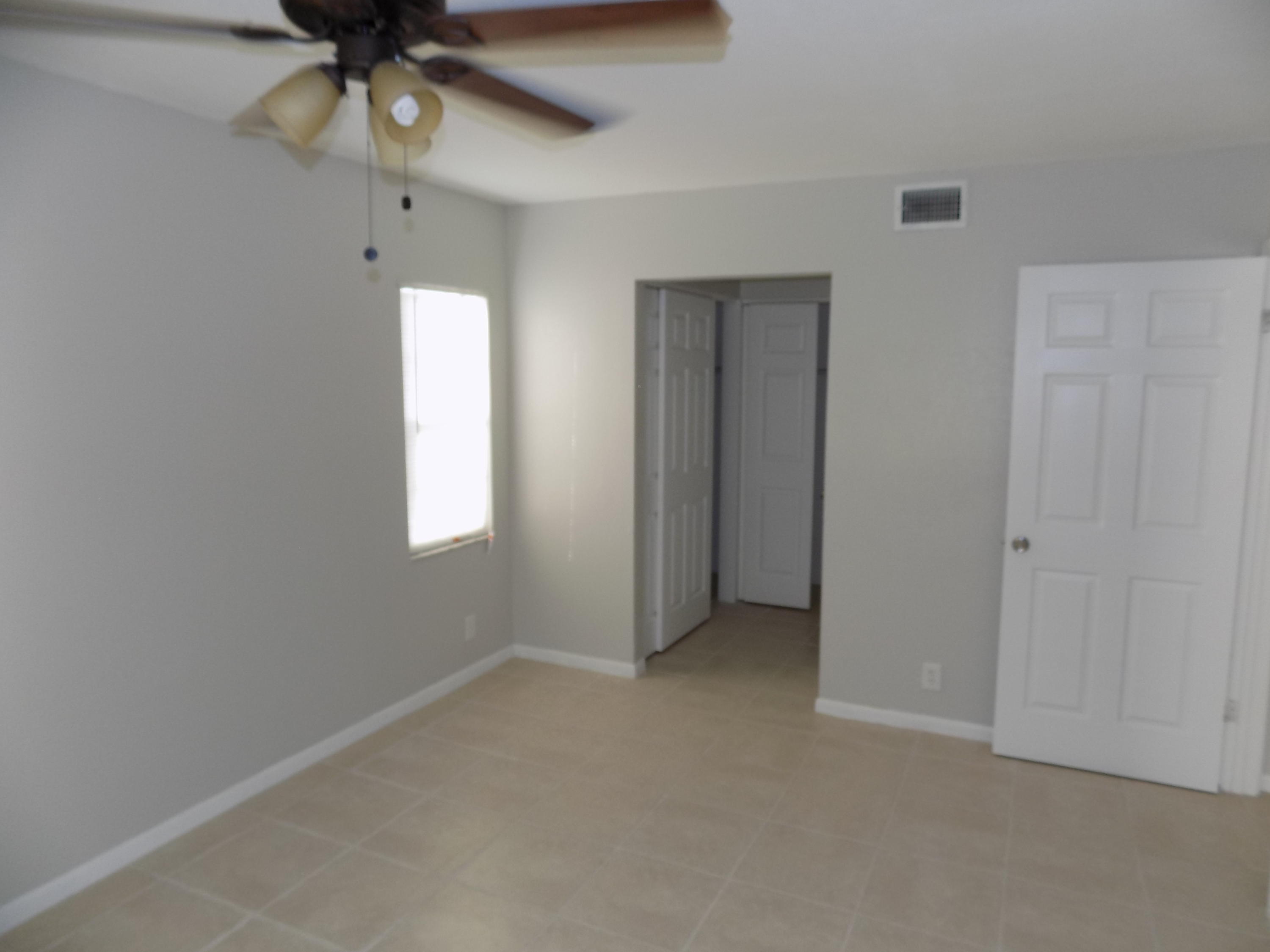 1798 Abbey Road, Unit C201 West Palm Beach, FL 33415 - Photo 9 of 26 Master Bedroom Suite