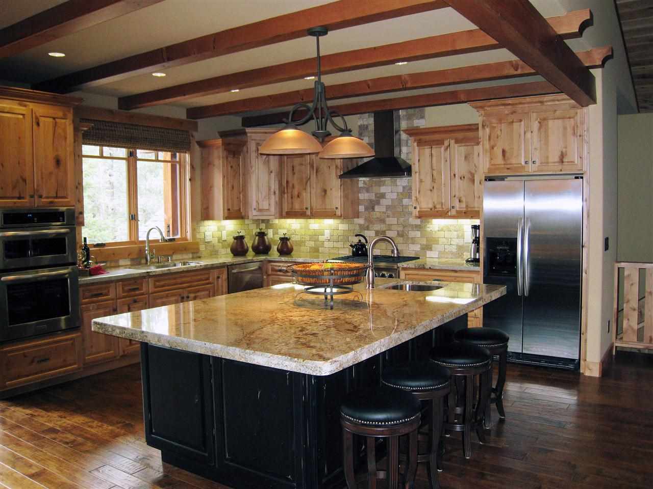 11563 Sun Valley Road Truckee, CA 96161 - Photo 6 of 14 a kitchen with stainless steel appliances granite countertop a sink a stove and a refrigerator