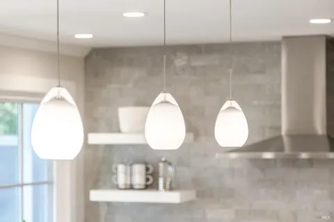 a kitchen with a sink and living room