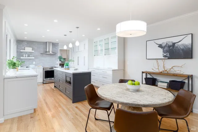 a kitchen with a table and chairs in it
