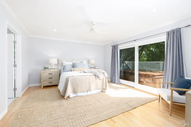 a bedroom with a large bed and a large window