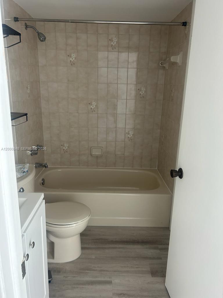11790 Southwest 18th Street, Unit 4053 Miami, FL 33175 - Photo 14 of 17 a bathroom with a bathtub and a toilet