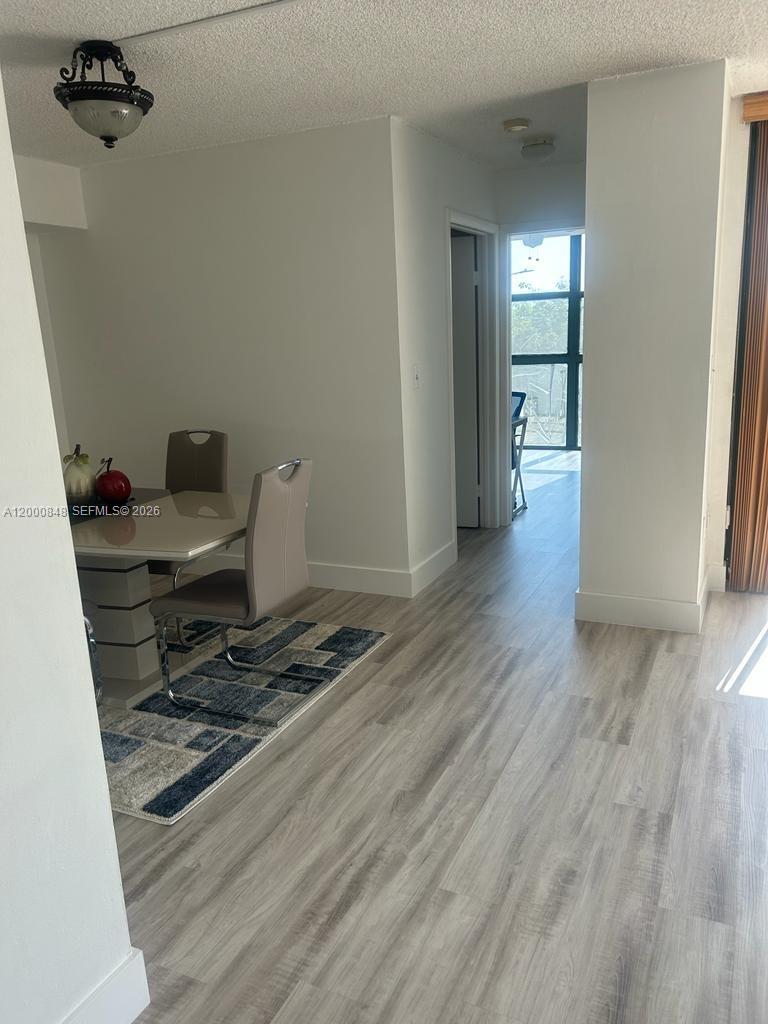 11790 Southwest 18th Street, Unit 4053 Miami, FL 33175 - Photo 15 of 17 a view of a workspace with wooden floor