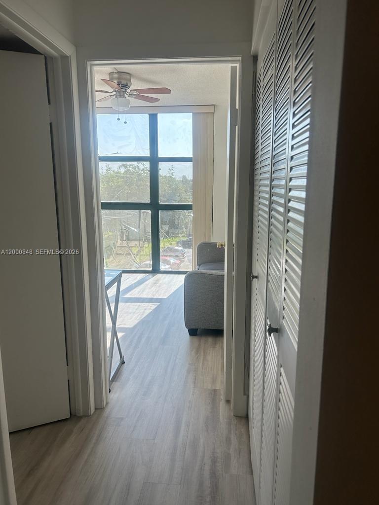 11790 Southwest 18th Street, Unit 4053 Miami, FL 33175 - Photo 16 of 17 a room with window and wooden floor