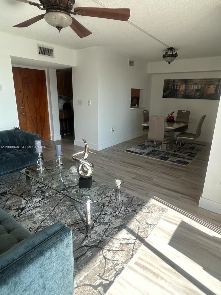 11790 Southwest 18th Street, Unit 4053 Miami, FL 33175 - Photo 3 of 17 a kitchen view with stove a sink and dishwasher
