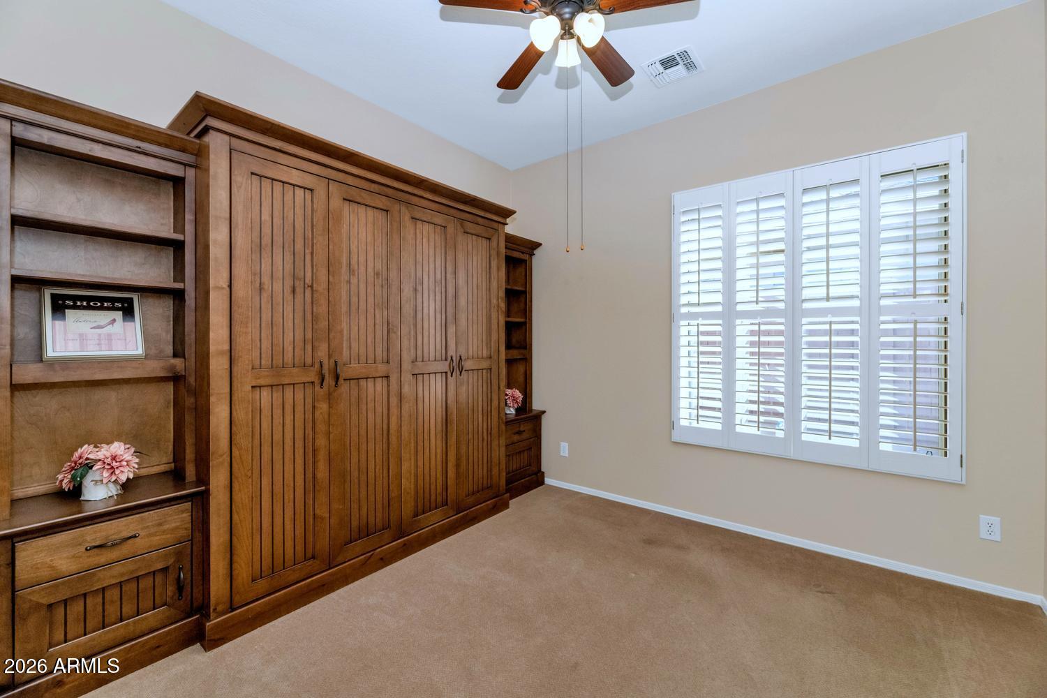 41123 North River Bend Road Phoenix, AZ 85086 - Photo 21 of 45 a view of a livingroom with an empty space and a window