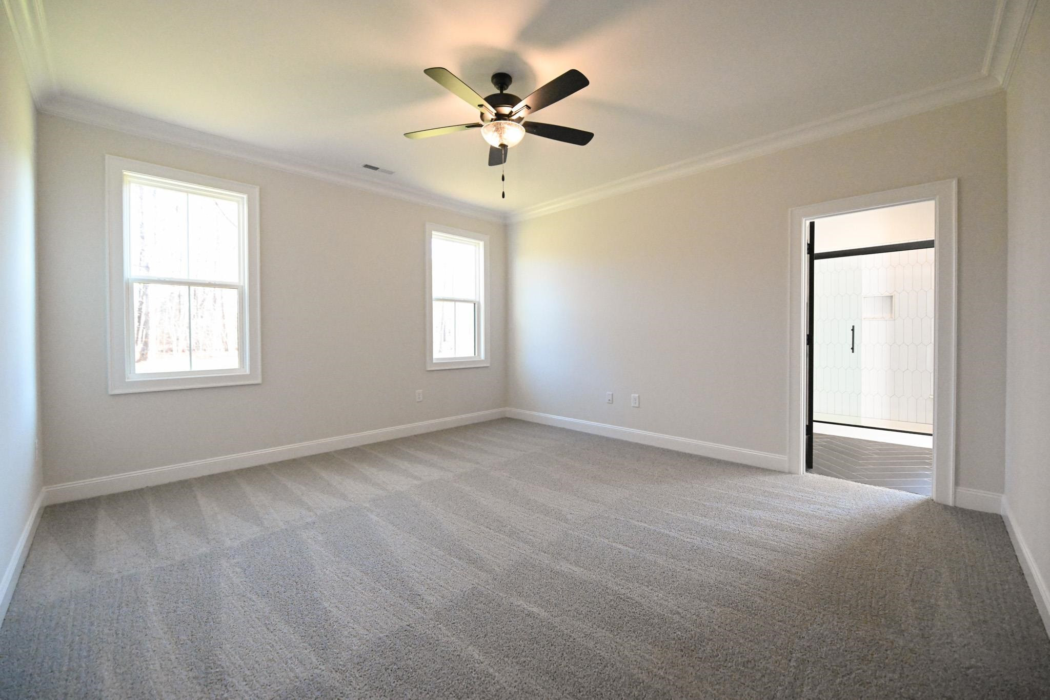 996 Barnes Road Middlesex, NC 27557 - Photo 20 of 39 an empty room with windows and ceiling fan