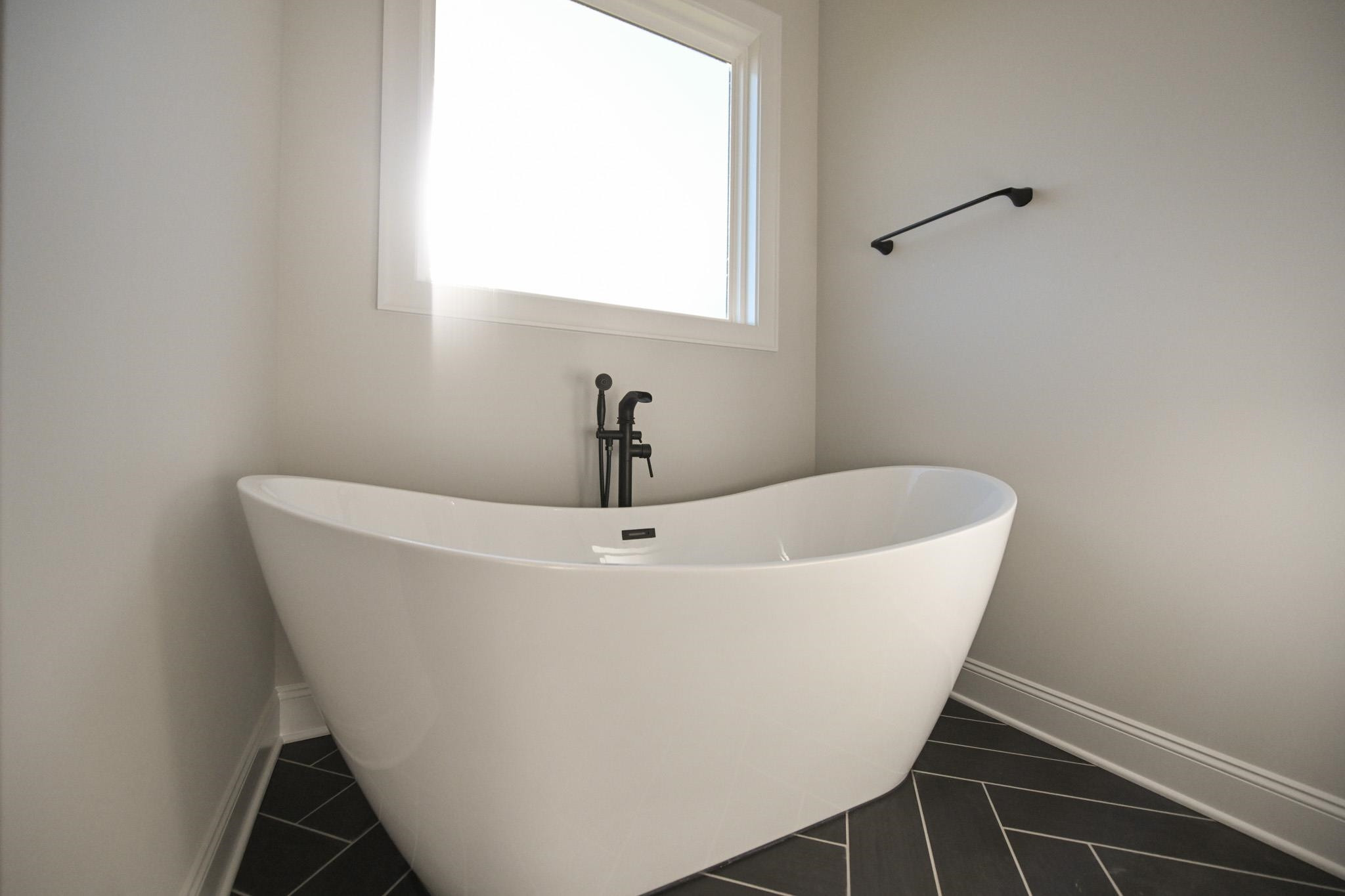 996 Barnes Road Middlesex, NC 27557 - Photo 26 of 39 a white bath tub sitting in a bathroom