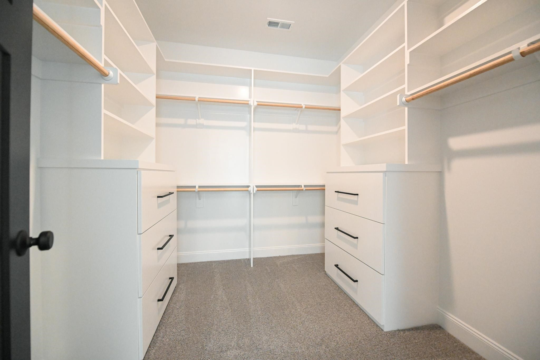 996 Barnes Road Middlesex, NC 27557 - Photo 29 of 39 a view of walk in closet with empty racks