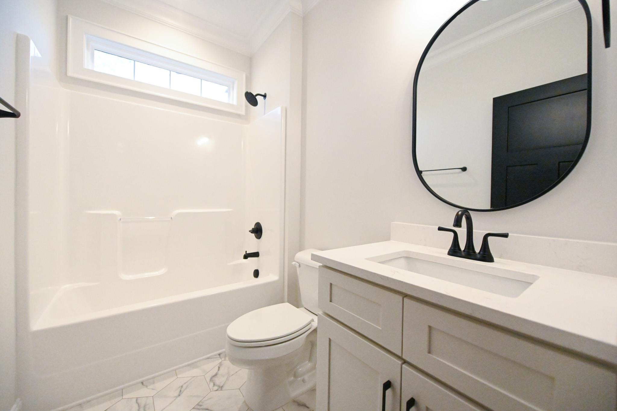 996 Barnes Road Middlesex, NC 27557 - Photo 32 of 39 a bathroom with a sink a toilet and shower