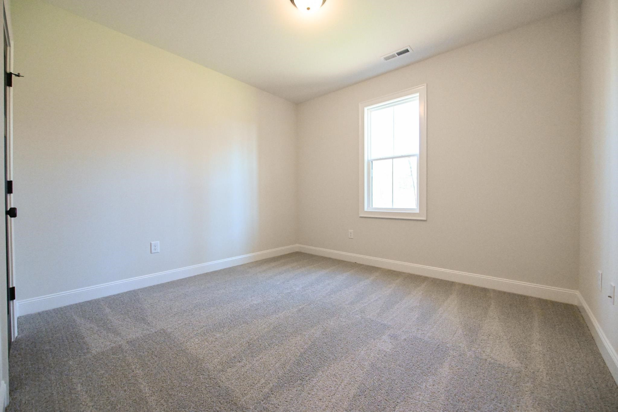 996 Barnes Road Middlesex, NC 27557 - Photo 33 of 39 an empty room with a window