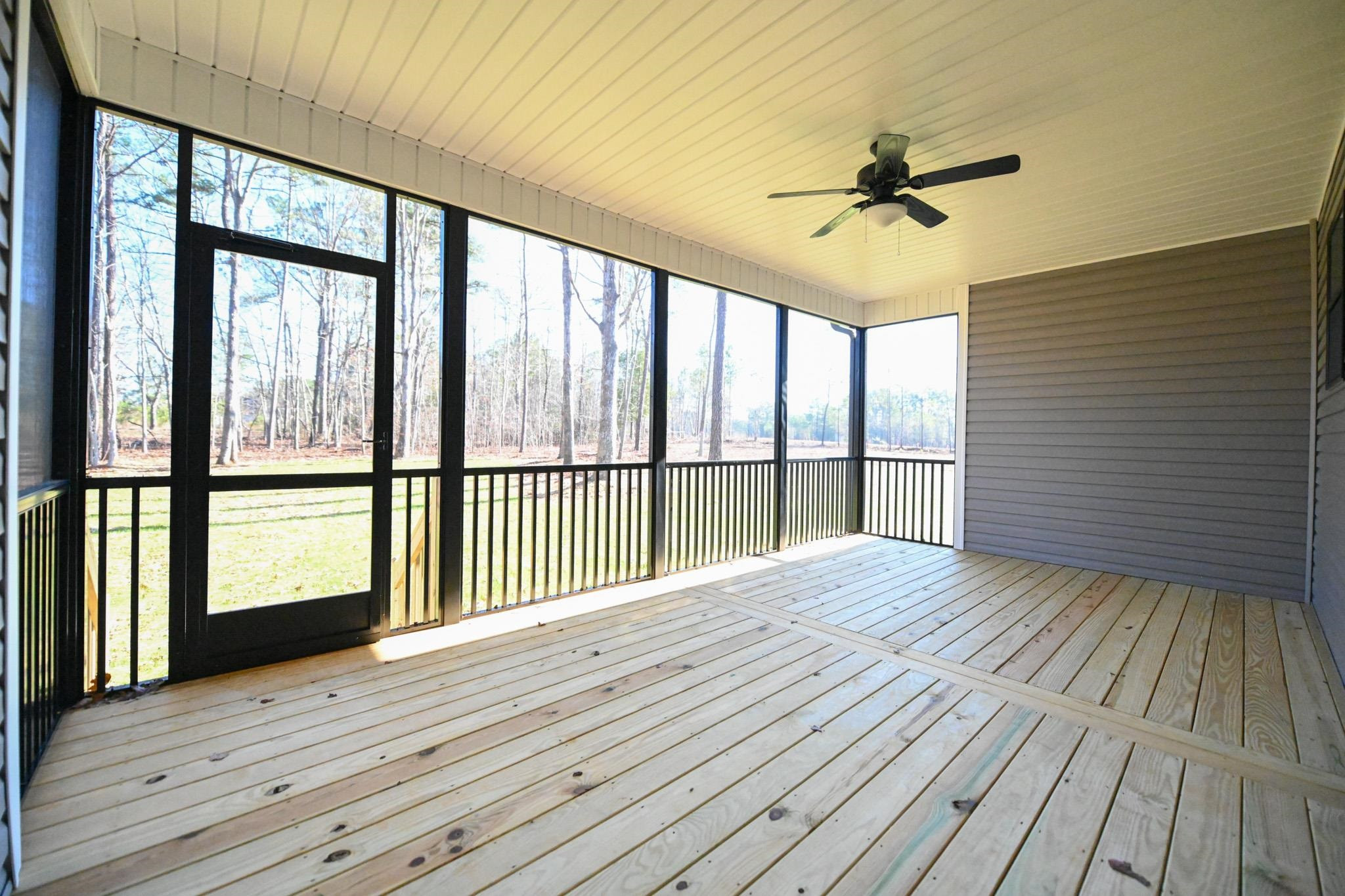 996 Barnes Road Middlesex, NC 27557 - Photo 35 of 39 a view of empty room with wooden floor and fan