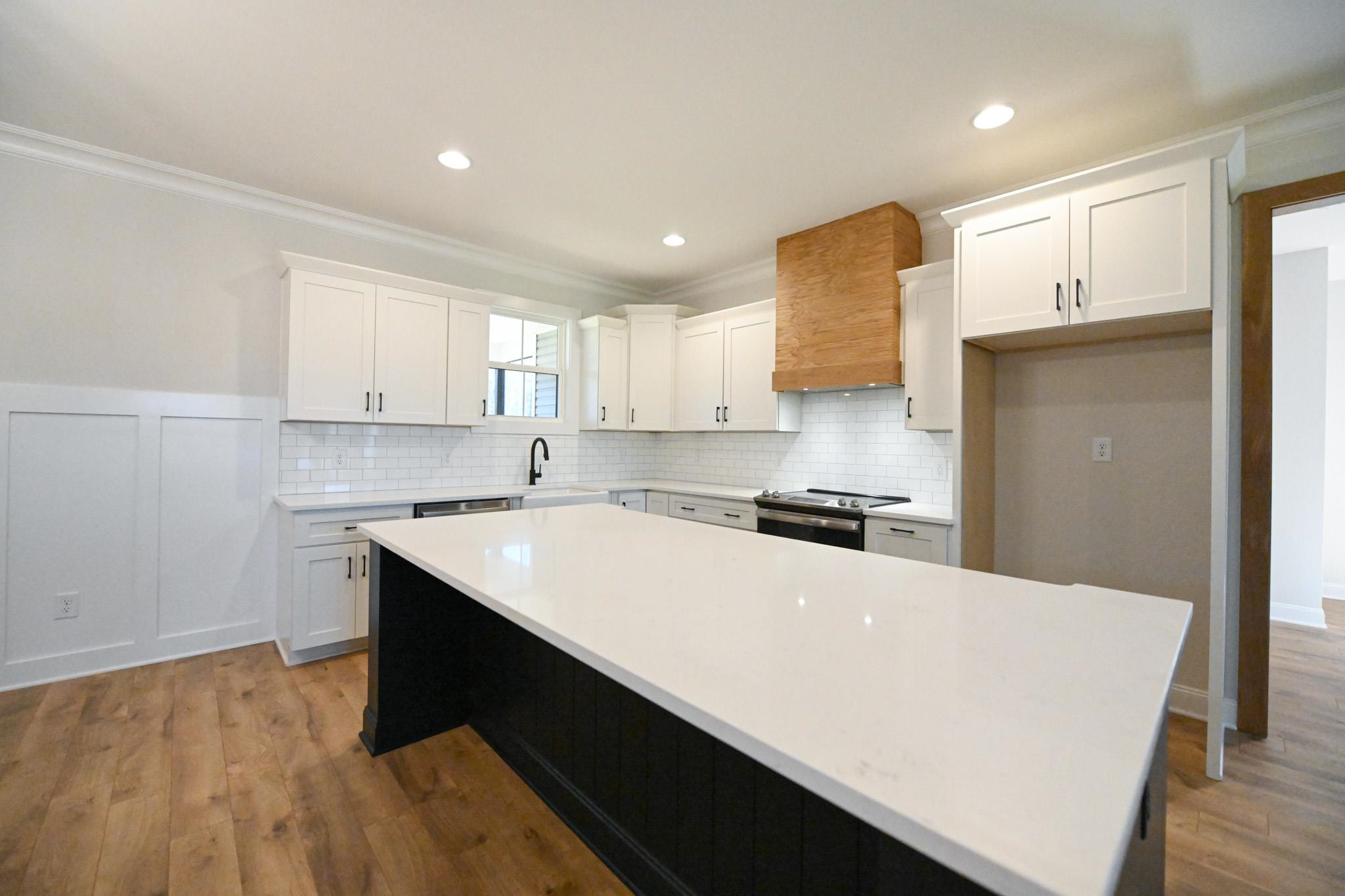 996 Barnes Road Middlesex, NC 27557 - Photo 9 of 39 a kitchen with a sink a stove a refrigerator and a microwave