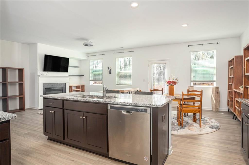 5760 Flint Lane Cumming, GA 30028 - Photo 13 of 39 a kitchen with a sink cabinets and wooden floor