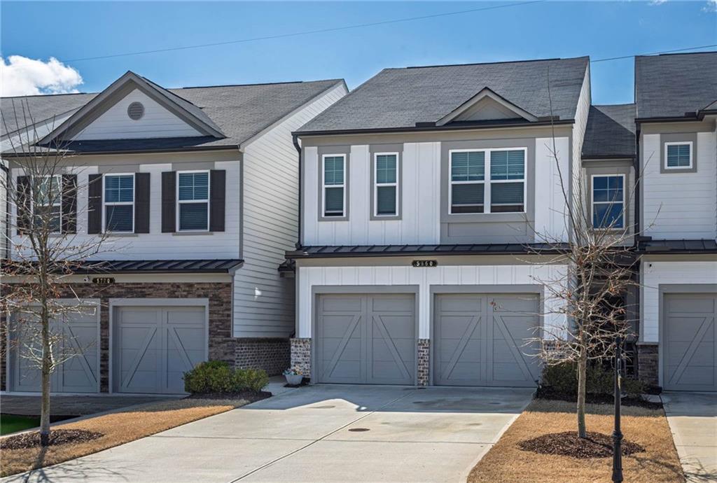 5760 Flint Lane Cumming, GA 30028 - Photo 2 of 39 a front view of a house with garden