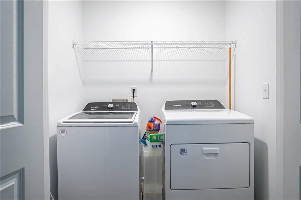5760 Flint Lane Cumming, GA 30028 - Photo 24 of 39 a utility room with dryer and washer