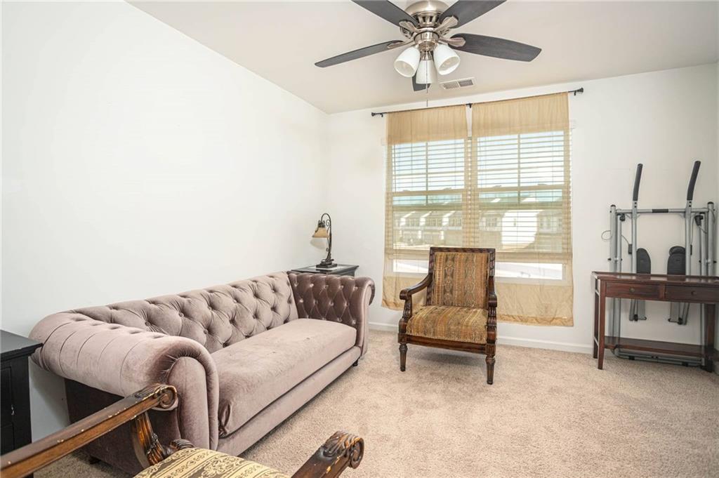 5760 Flint Lane Cumming, GA 30028 - Photo 25 of 39 a living room with furniture and a window