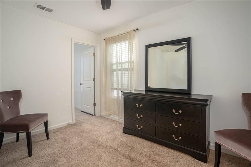 5760 Flint Lane Cumming, GA 30028 - Photo 28 of 39 a room with a dresser and a mirror
