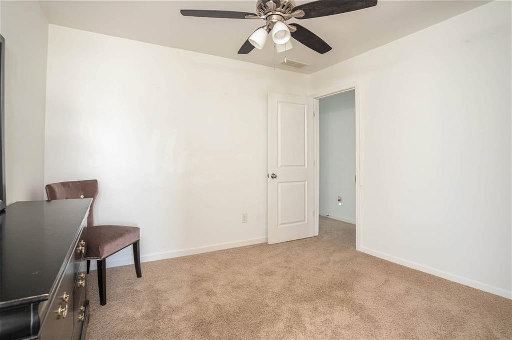 5760 Flint Lane Cumming, GA 30028 - Photo 29 of 39 a view of an empty room and chandelier fan