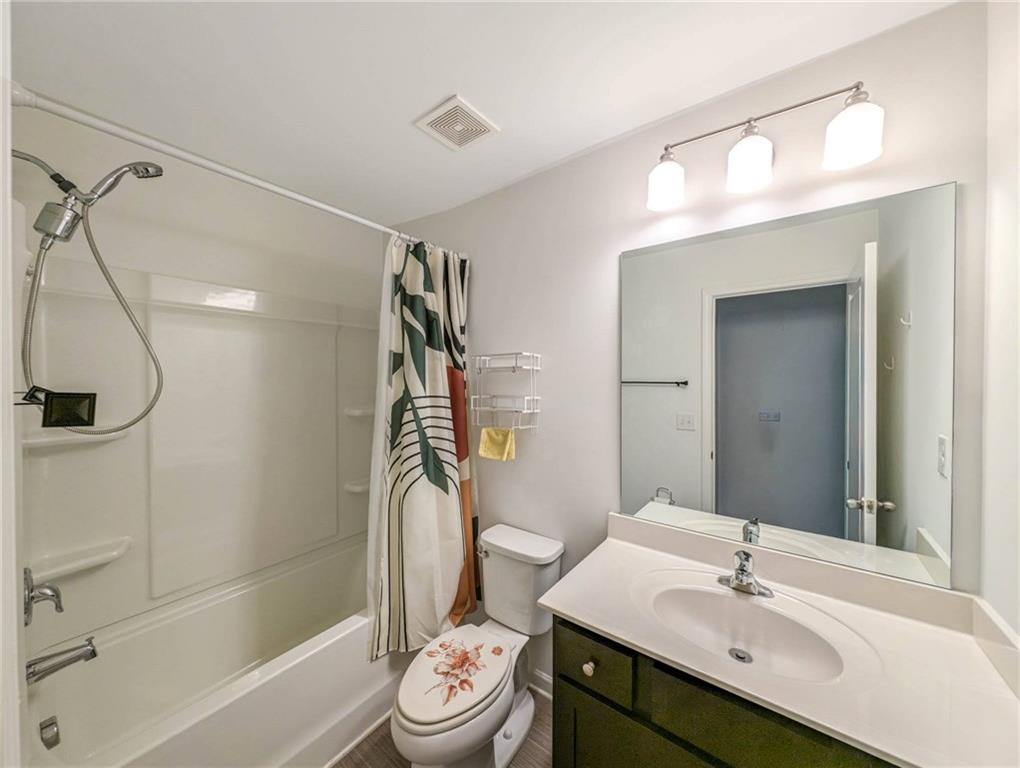 5760 Flint Lane Cumming, GA 30028 - Photo 31 of 39 a bathroom with a sink toilet and shower
