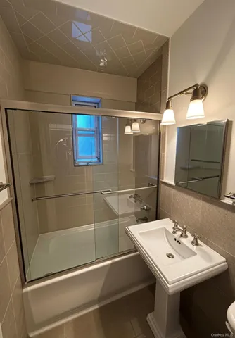 a bathroom with a sink and mirror