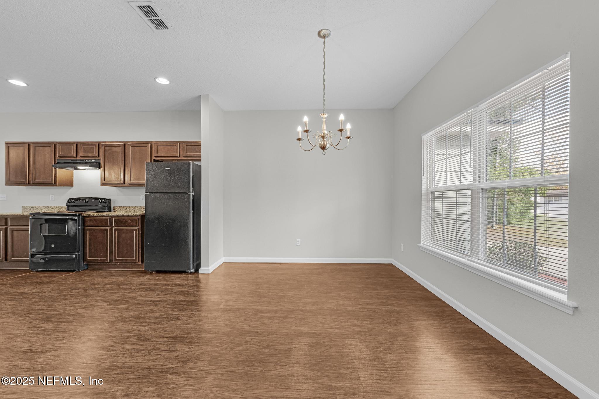 5120 Dugdale Road Jacksonville, FL 32210 - Photo 7 of 32 a kitchen with stainless steel appliances granite countertop a refrigerator and a sink