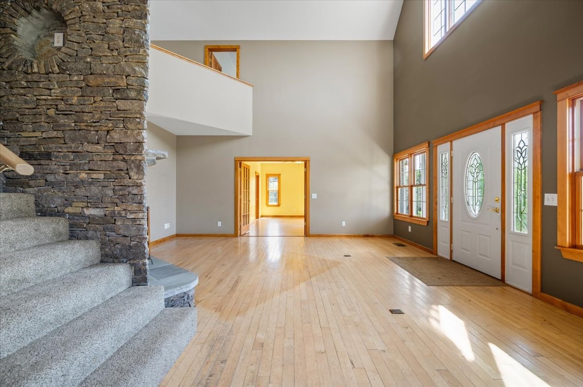 216 Old Wolf Hill Road Bethpage, TN 37022 - Photo 13 of 70 a view of an empty room with a window and wooden floor