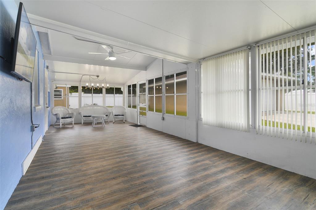 916 Fernald Street Edgewater, FL 32132 - Photo 14 of 27 a view of a livingroom with wooden floor and furniture