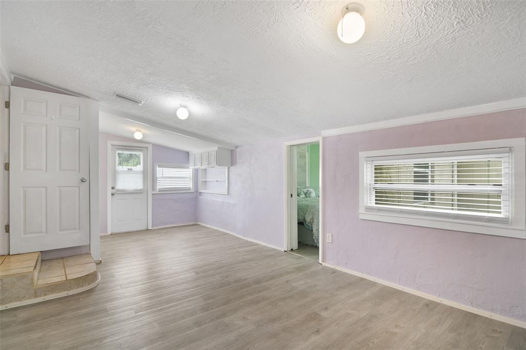 916 Fernald Street Edgewater, FL 32132 - Photo 18 of 27 wooden floor in an empty room with a window
