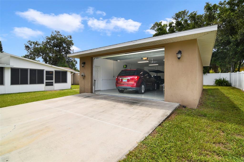 916 Fernald Street Edgewater, FL 32132 - Photo 22 of 27 a view of a house with backyard and porch