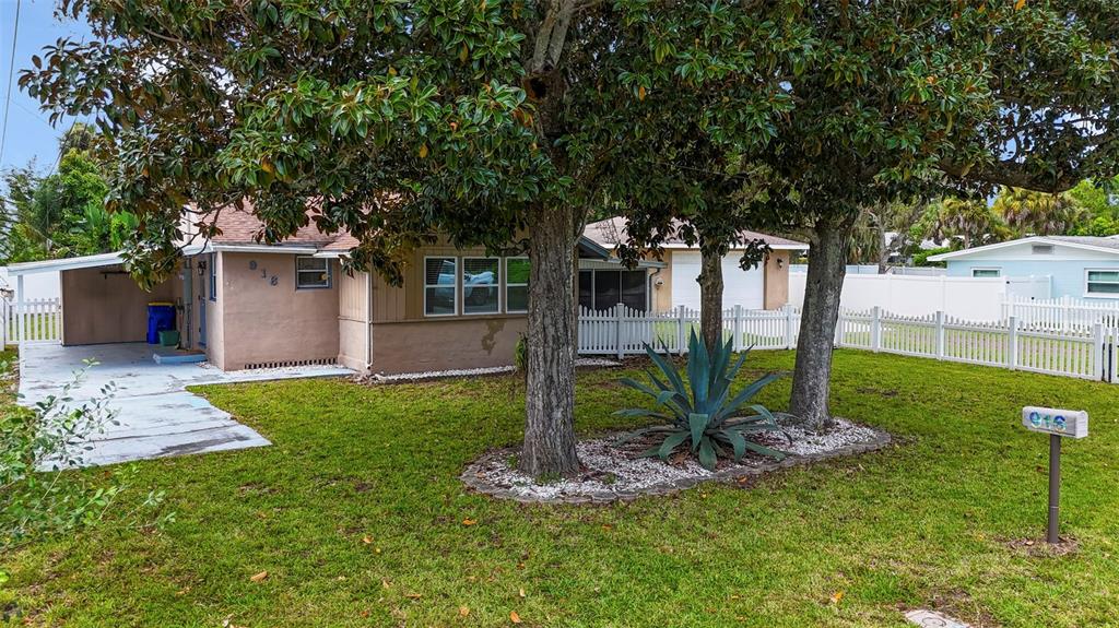916 Fernald Street Edgewater, FL 32132 - Photo 25 of 27 a front view of a house with garden