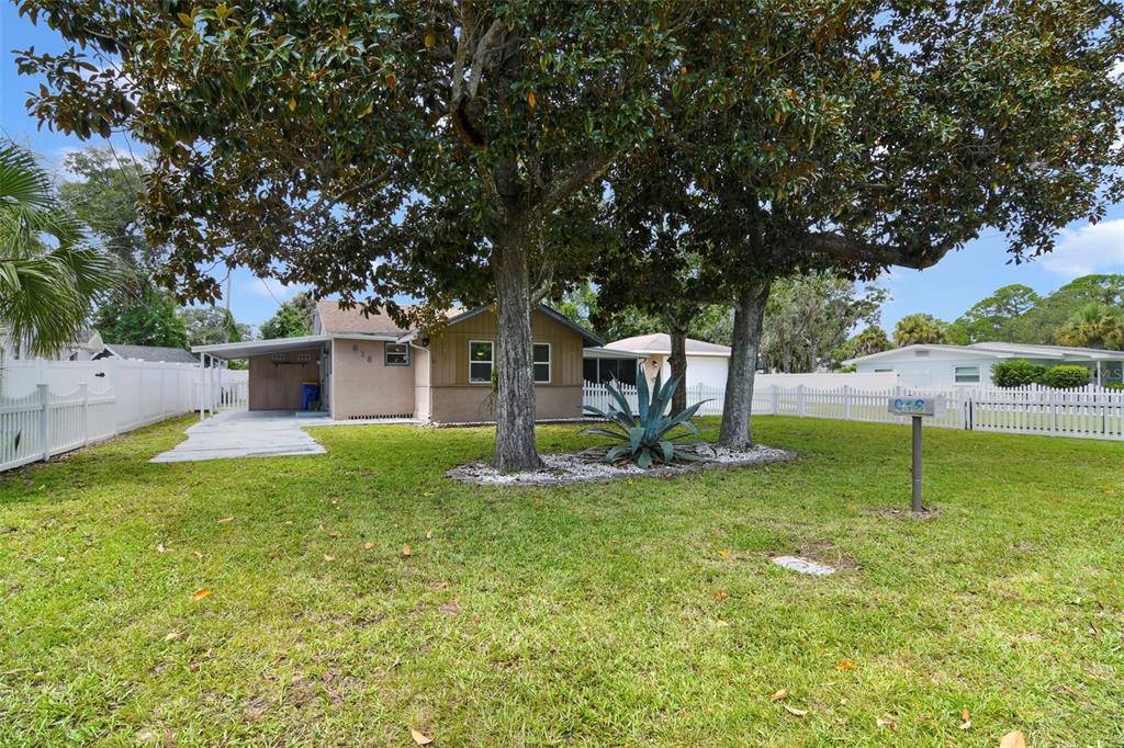 916 Fernald Street Edgewater, FL 32132 - Photo 26 of 27 a view of a house with a backyard and a tree
