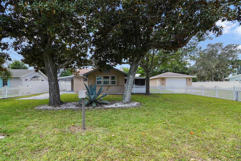 916 Fernald Street Edgewater, FL 32132 - Photo 27 of 27 a front view of a house with garden